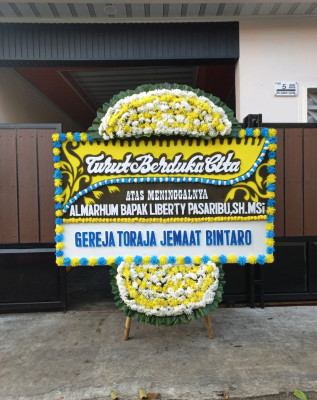 Papan Bunga Duka di Airu